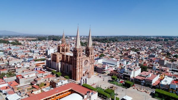 How does urban development impact UK real estate values?